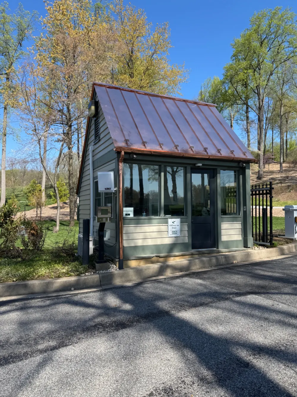 Copper standing seam metal roof installed on a commercial guard house