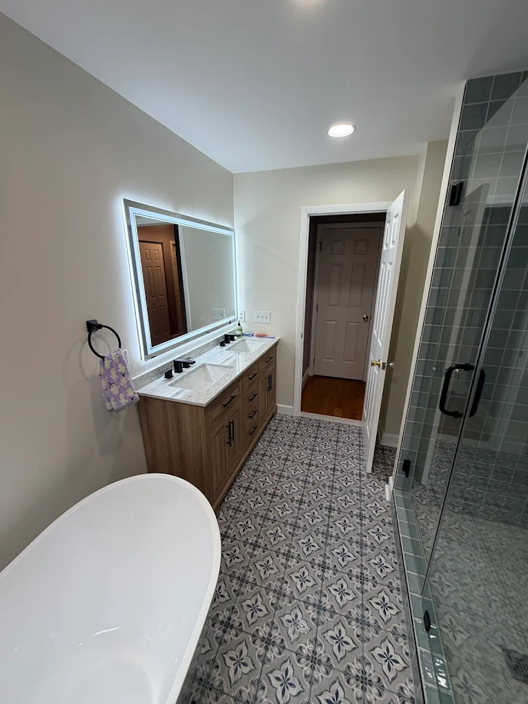 Bathroom remodel with freestanding tub and patterned tile floor