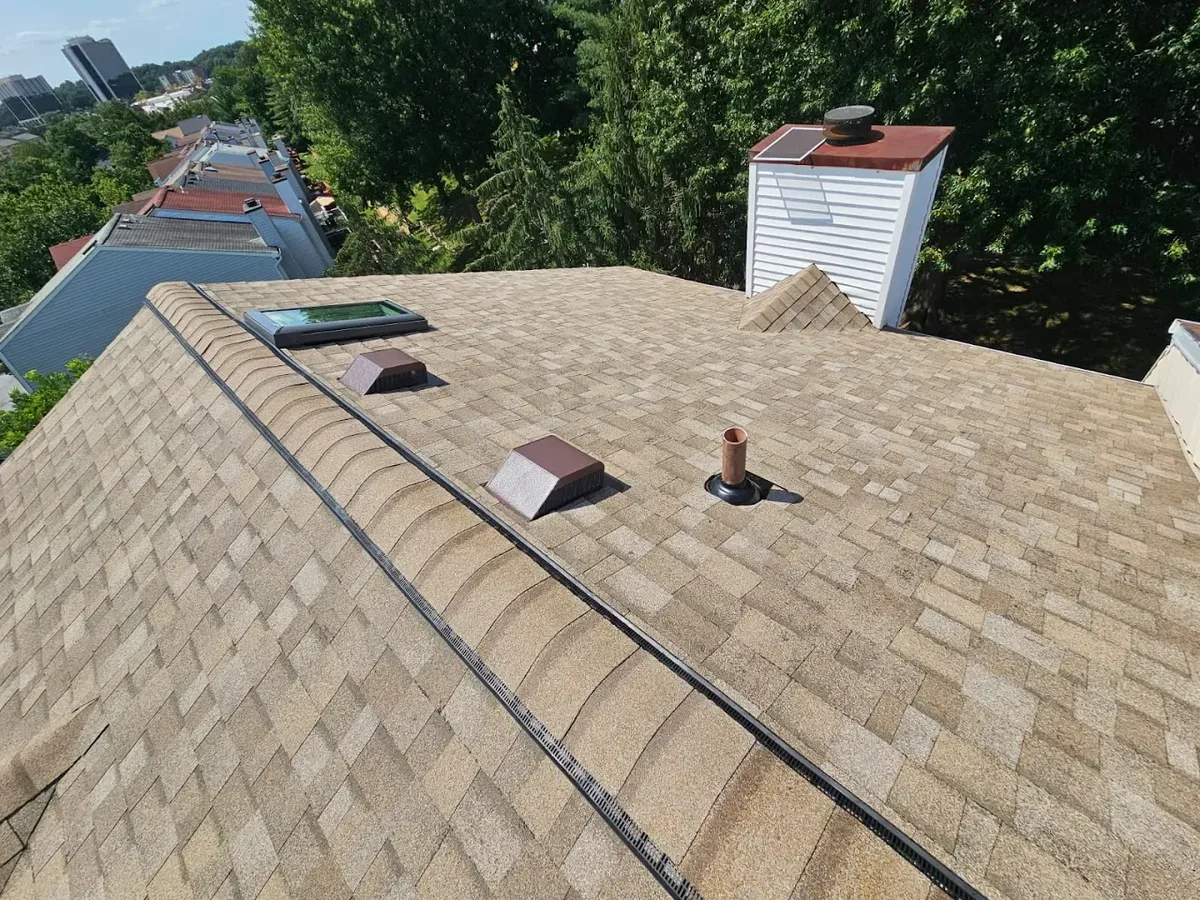 Completed roof replacement with skylight and vents in Baltimore