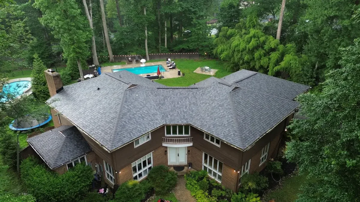 Crown Remodeling roofer installing architectural shingles